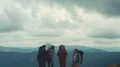 The flight near a mountain with four active people 4k or 4k+ Resolution