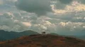 The flight near the mountain with four hikers 4k or 4k+ Resolution