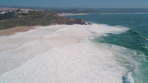 Flight near Rock and Lighthouse near City of Nazare Stock Footage 89886871