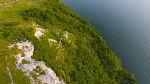 Flight near the rocks of sunset Stock Footage 77177311