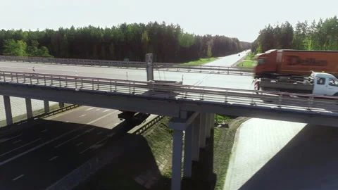 The flight is near a traffic intersection, road workers are doing repair work Stock Footage 139879007