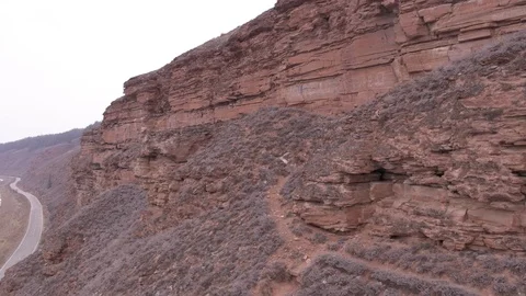 Flight near winter rocks and road Video stock 123710210