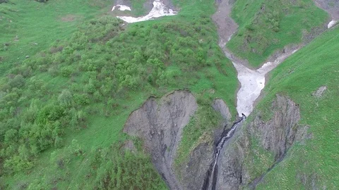 Flight next to mountain waterfall in the form of heart Stock-Footage 77180693