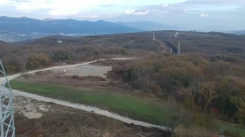 Flight next to power lines cloudy weather. Large power pole in the frame Stock Footage 231716298