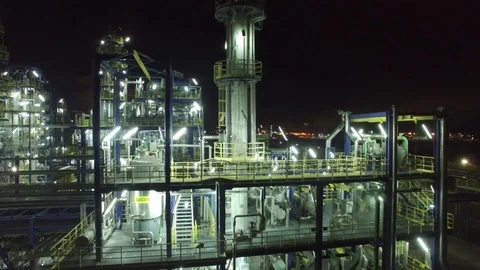 Flight at night over a lighted chemical installation, chemical factory 库存影片 73661344