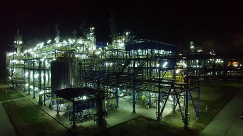 Flight at night over a lighted chemical installation, chemical factory Stock Footage 73661423