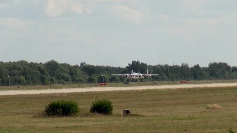 Flight of North American Mitchell B-25 bomber at low altitude above runway. Stock Footage 120804267