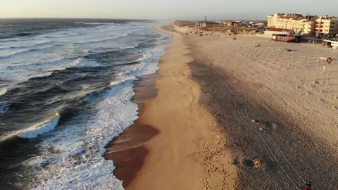 Flight on the ocean sandy shore in the early morning, Portugal, Furadouro. Stock Footage 148556978
