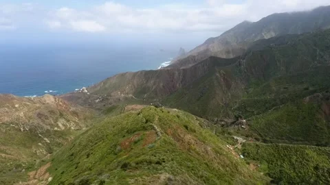 Flight to the ocean shore over mountains covered with green forests Stock Footage 219286196