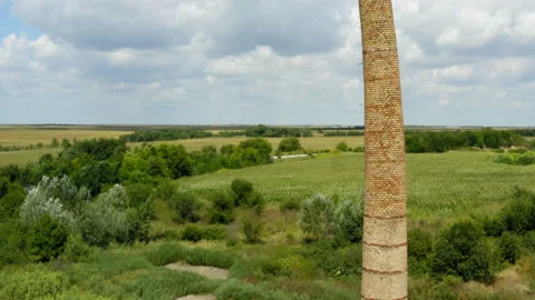 Flight by an old brick chimney in the fields Stock Footage 137718636