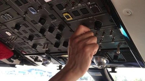 Before the flight operations by a pilot in a cockpit Stock Footage 84888262