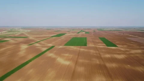 Flight over agricultural arable land fields Stock Footage 83467775