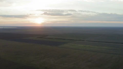 Flight over agricultural fields at sunset Stock Footage 138648755
