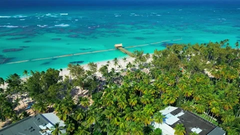 Flight over the all-inclusive beach resort territory in tropical Punta Cana Video stock 307291979