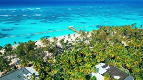 Flight over the all-inclusive beach resort territory in tropical Punta Cana Stock Footage 309069802