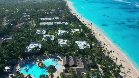 Flight over the all-inclusive beach resort territory in tropical Punta Cana Stock-Footage 309069848