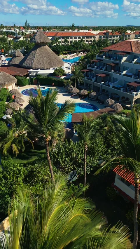 Flight over the all-inclusive beach resort territory in tropical Punta Cana Stock Footage 311340240