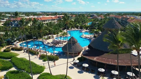 Flight over the all-inclusive beach resort territory in tropical Punta Cana Video stock 311340256