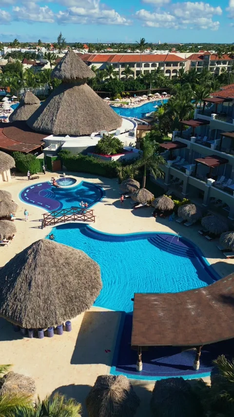 Flight over the all-inclusive beach resort territory in tropical Punta Cana Stock Footage 311340266