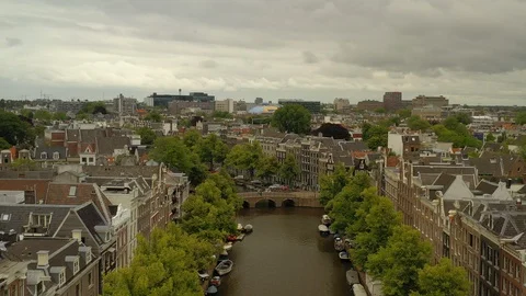 Flight over amsterdam cityscape cloudy day canal aerial panorama 4k netherlands Stock Footage 115032916
