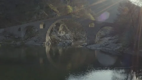 Flight over an ancient stone devil bridge in Bulgaria (D-log) Stock Footage 105857758