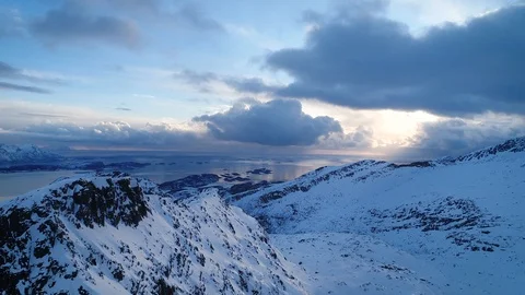 Flight Over Arctic Mountain Range With Ocean in Background 스톡 동영상 123179313