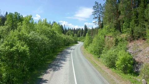 Flight over the asphalt road with a smooth rise up. Stock Footage 116660005