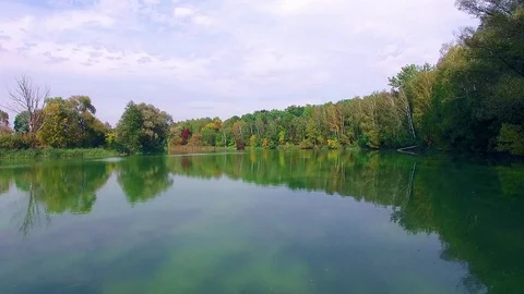 Flight over the autumn lake Stock Footage 105425843