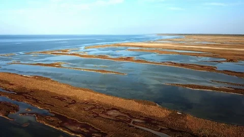 Flight over autumn steppe with lakes Stock Footage 120698636