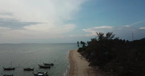 Flight over the beach, the beach between the forest and the sea, boats Stock Footage 149376373