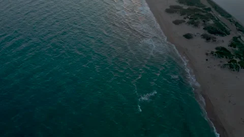 Flight over the beach of the Bugaz Spit against the backdrop of sunset. Stock Footage 169876810