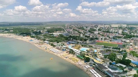 Flight over the beach of the resort. Shadows from clouds on the water Video stock 85893599