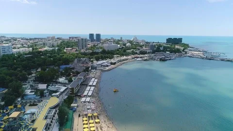 Flight over the beach of the resort. Shadows from clouds on the water Video stock 85893684