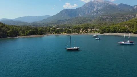 Flight over a beautiful clean beach in Turkey Kemer Stock Footage 168365937