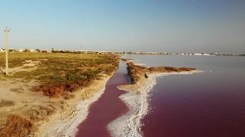 Flight over the beautiful pink colored salt lagoon of Torrevieja in Spain. Stock Footage 138208490