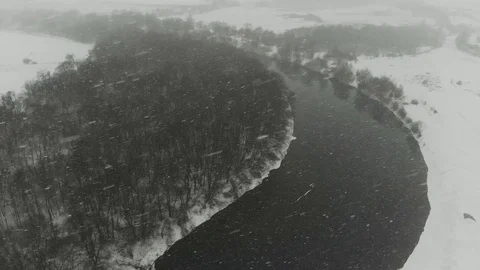 Flight over the beautiful winter river and snowy forest Stock Footage 120305781