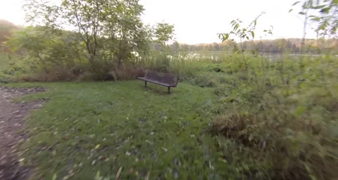 Flight over bench to sunrise over river.mp4 Stock Footage 55305168
