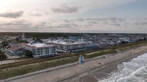 Flight over Bethany Beach Delaware boardwalk and beach at sunset 스톡 동영상 289030691