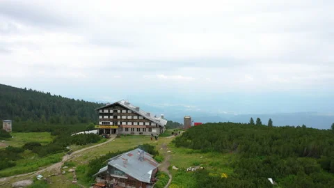 Flight over The Bezbog hut and lake, a lake situated in the Pirin Mountains Stock Footage 159356367