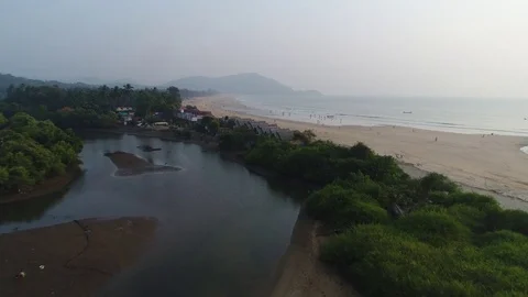 Flight over big sandy beach in the evening. Aerial view. Video stock 85110188