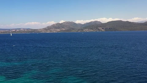 Flight over the blue sea. Video stock 115635497