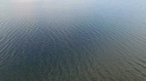 Flight over blue water Stock Footage 67980480