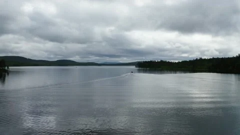 Flight over boat on Lake Inari Stock Footage