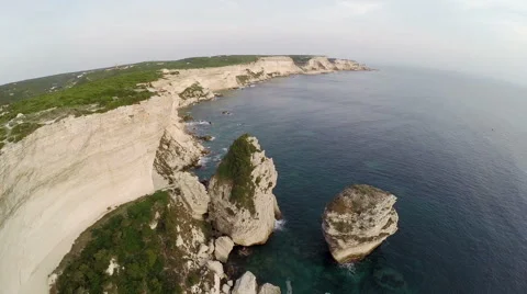 Flight over Bonifacio bay area at sunset. Corsica, France. Aerial view. 動画素材 47415530