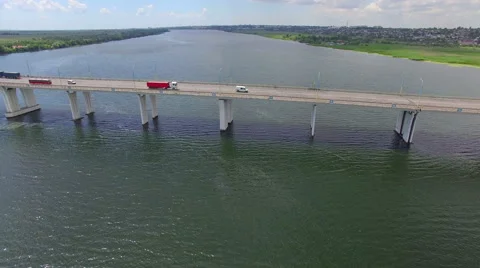 Flight over the bridge across the river Stock Footage 67980610