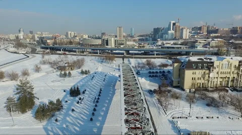 Flight over the bridge element. flying over the frozen river. city quay Stock Footage 60756359