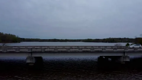 Flight over bridge with traffic passing by Видео 237945351