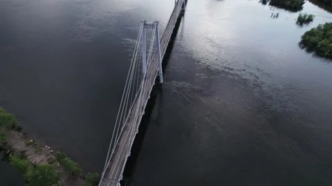 Flight over the bridge of a wide river Stock Footage 170884609