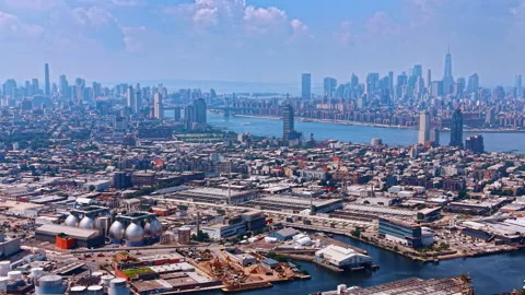 Flight over Brooklyn and Queens with storage tanks, scrap yards, manufacturing Stock Footage 342077562