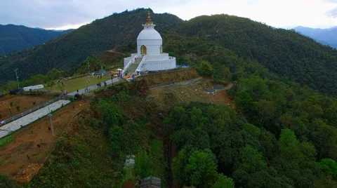Flight over buddhist stupa 4k aerial video. Pagoda Pokhara Valley Nepal Stock Footage 64822012